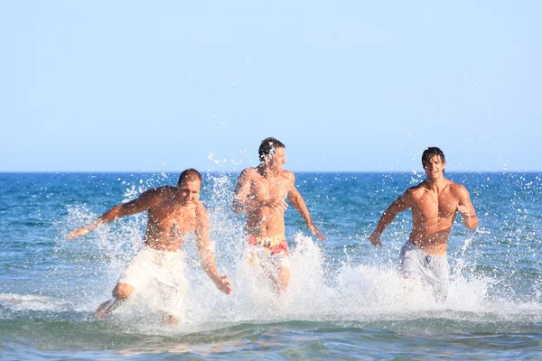 depositphotos_18642619-stock-photo-three-young-men-relaxing-on